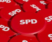 SPD - Social Democratic Party of Germany. Some political badges, campaign button on the table. Democratic party,  opposition, german government. 3D illustration